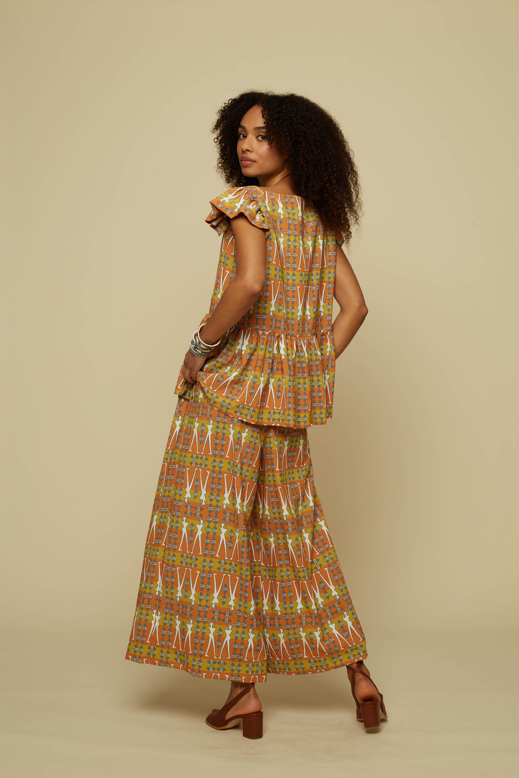 SCHEMA PANTS (BROWN GEO HUMAN FIGURE PRINT)