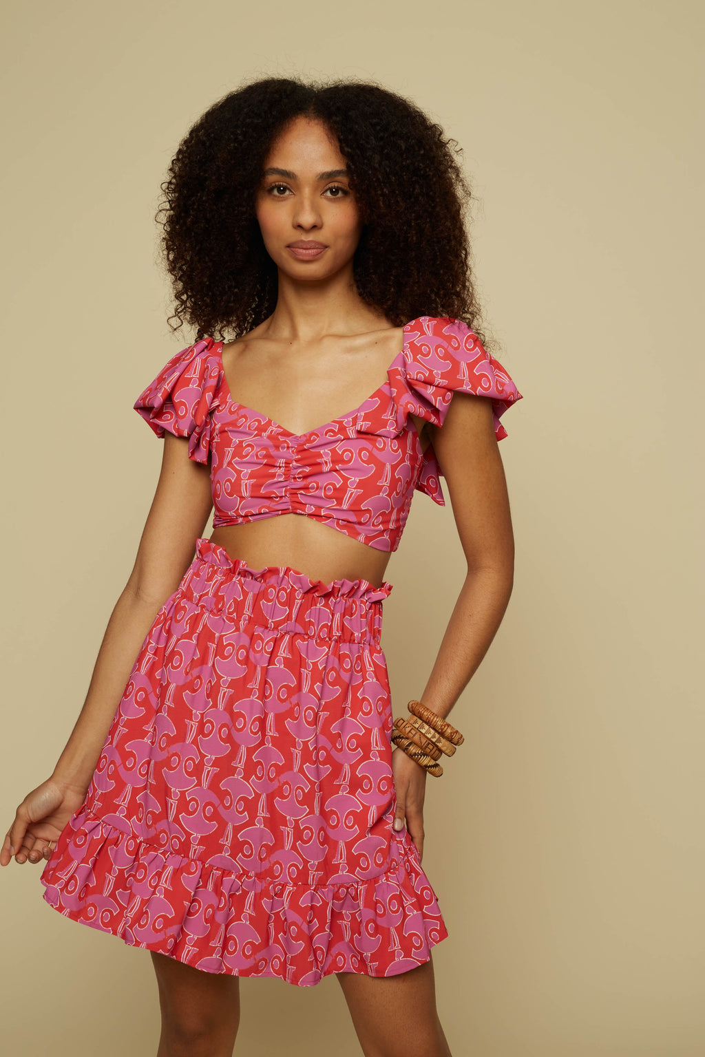 TECTON MINI SKIRT (PINK GEO PEOPLE PRINT)