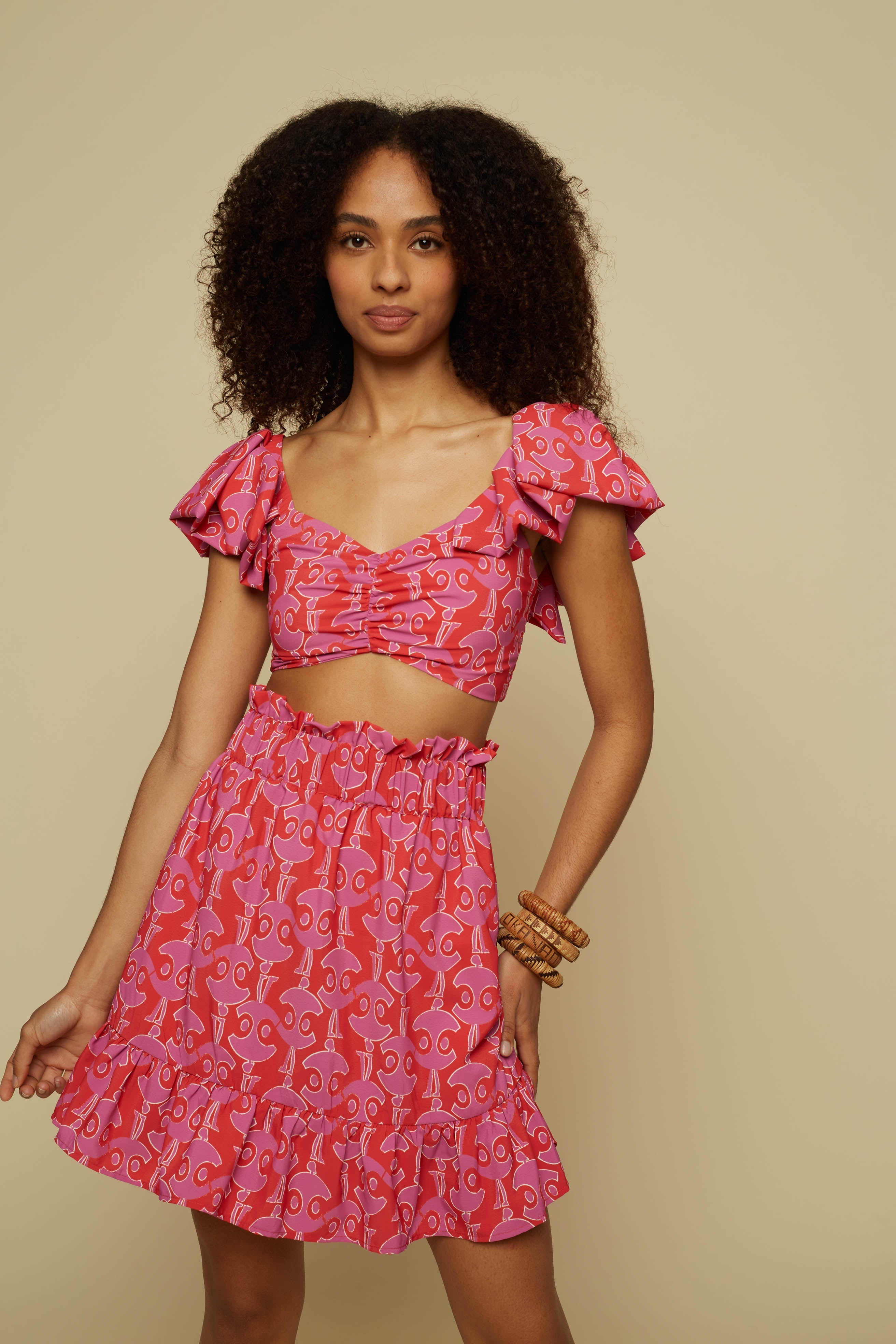 TECTON MINI SKIRT (PINK GEO PEOPLE PRINT)