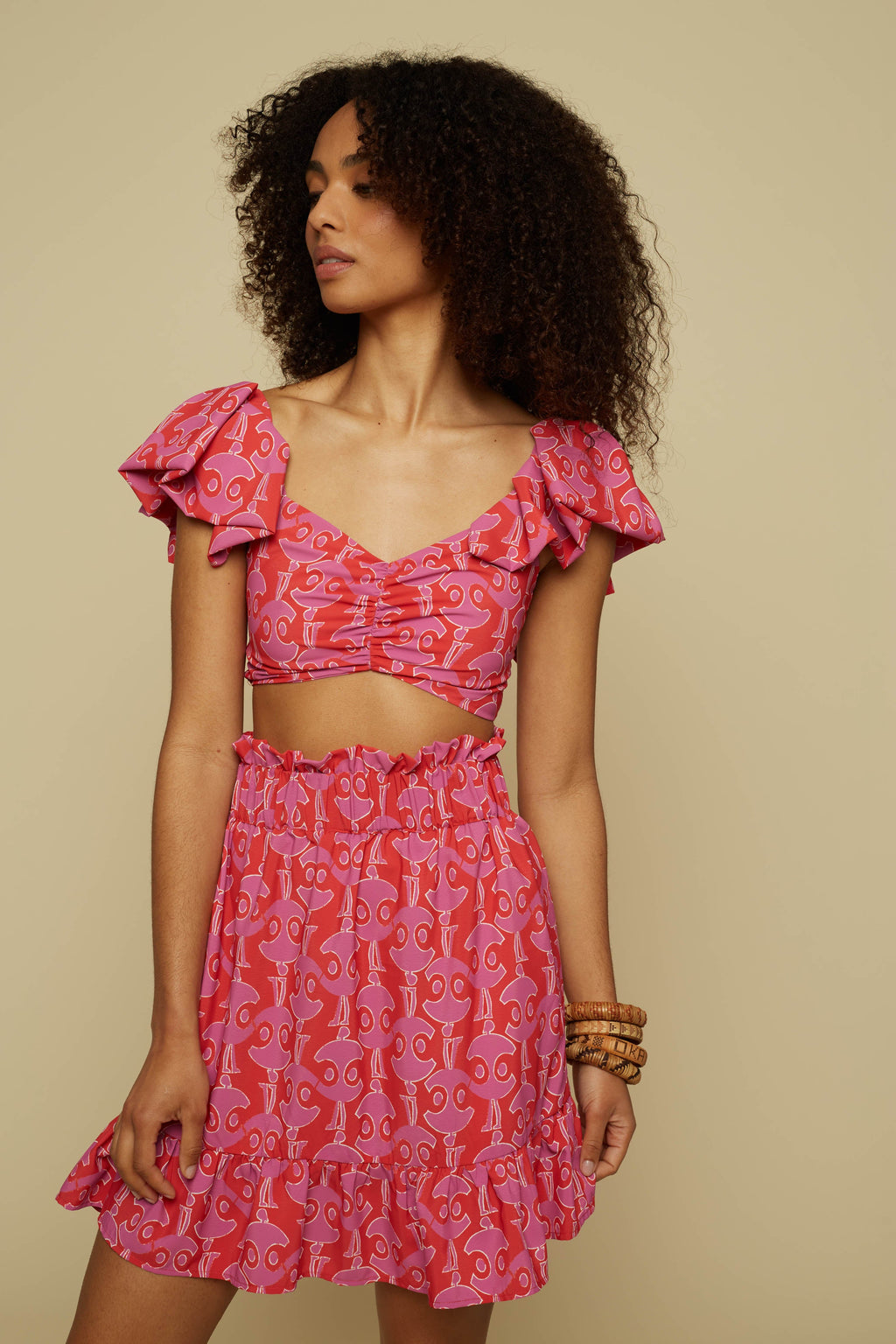 TECTON CROP TOP (PINK GEO PEOPLE PRINT)